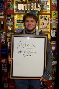 Alex (FM Programming Director, Sting and FM DJ) in front of the Sticker Door