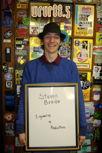 Steven (Engineering and Productions) in front of the Sticker Door