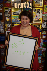 Ary (Music) in front of the Sticker Door