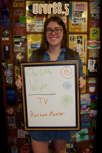 Charlotte (WRUR-TV) in front of the Sticker Door