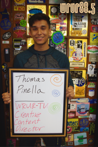 Thomas (WRUR-TV) in front of the Sticker Door